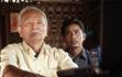 Sambath and Nuon Chea watch Pol Pot on film